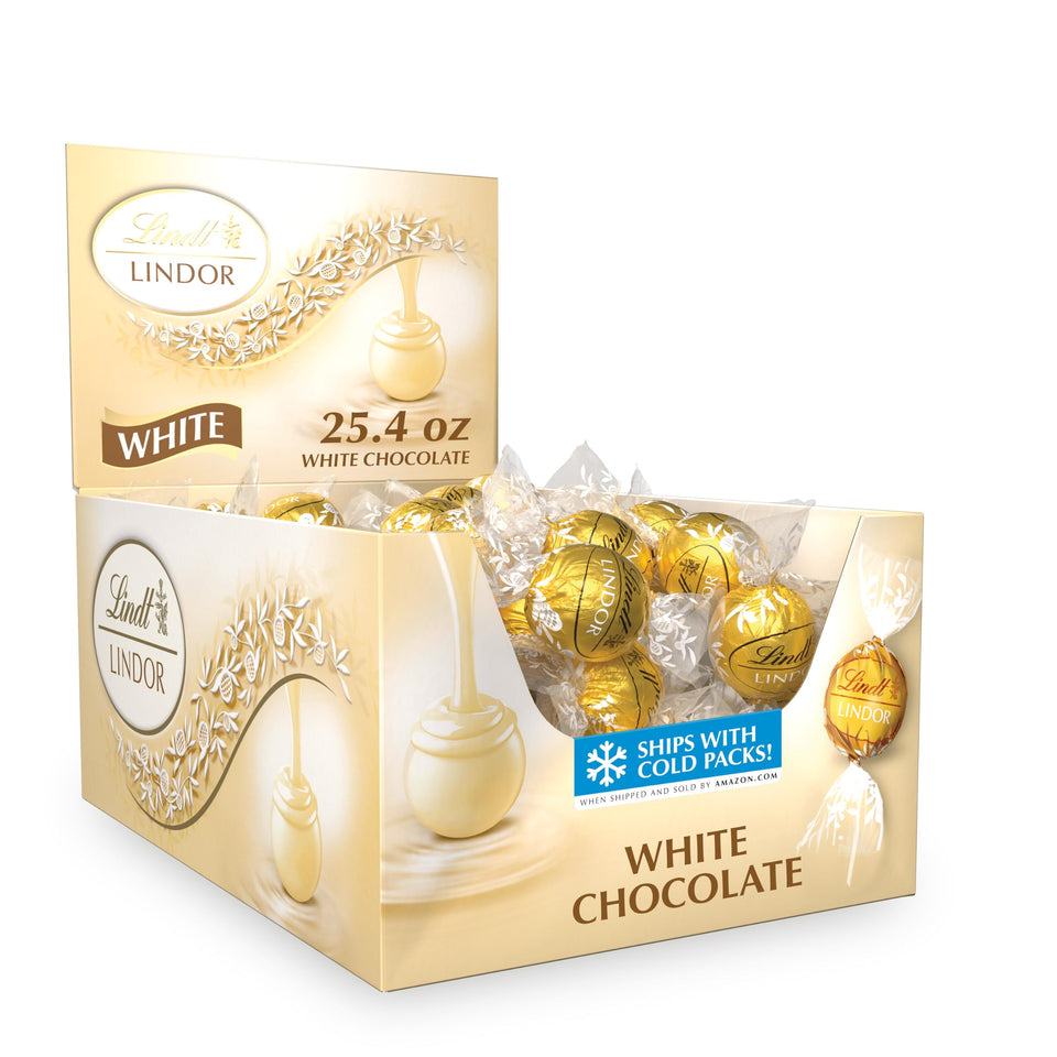 Lindt LINDOR White Truffles shell close-up, glossy white chocolate shell and shine