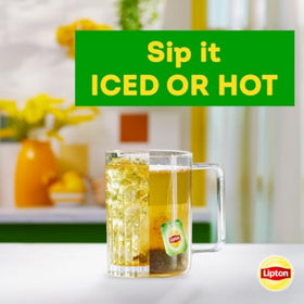 Six-pack Lipton Peach Green Tea boxes on a shelf for convenient brewing