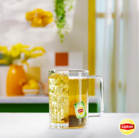 Lipton green tea steeping in cup with a gentle jasmine note.