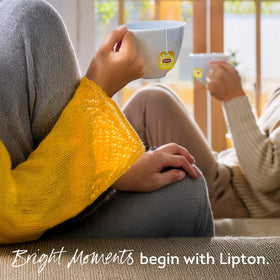 Lipton Yellow Label tea bag immersion in hot water for quick brew.