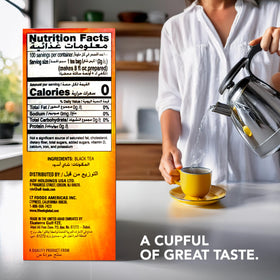 Lipton Yellow Label tea bag steeping in hot water for a rich, bold flavor.