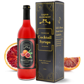 Liquid Alchemist Blood Orange Syrup bottle on a bar shelf showcases natural ingredients.