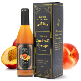 Liquid Alchemist Peach Syrup bottle pour showing vibrant peach flavor for cocktails