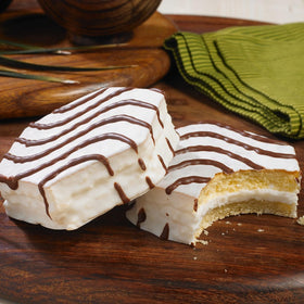 Little Debbie Zebra Cakes creme-filled cakes highlight creamy center for snacking.