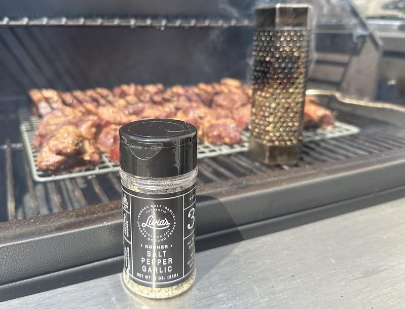Burger patty coated with Livia's Salt Pepper Garlic for crave-worthy flavor