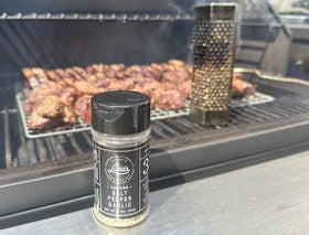 Burger patty coated with Livia's Salt Pepper Garlic for crave-worthy flavor