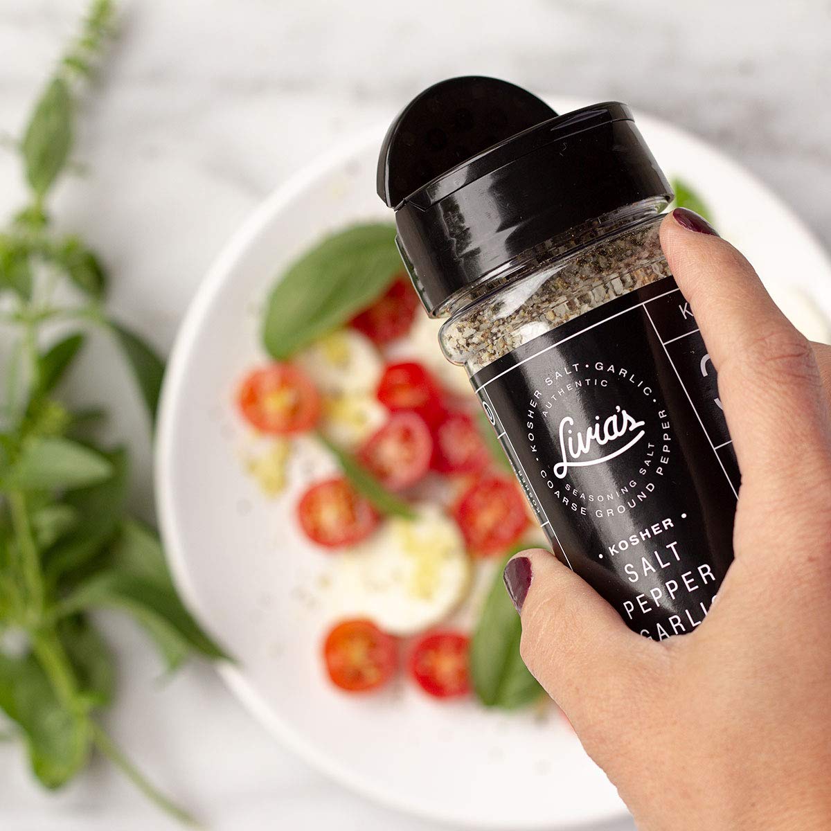 Livia's seasoning shaker on the counter for quick, flavorful meals