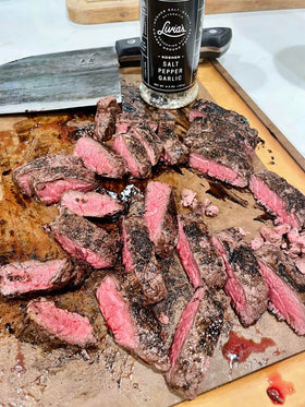 Steak seasoned with Livia's Salt Pepper Garlic for enhanced savory crust