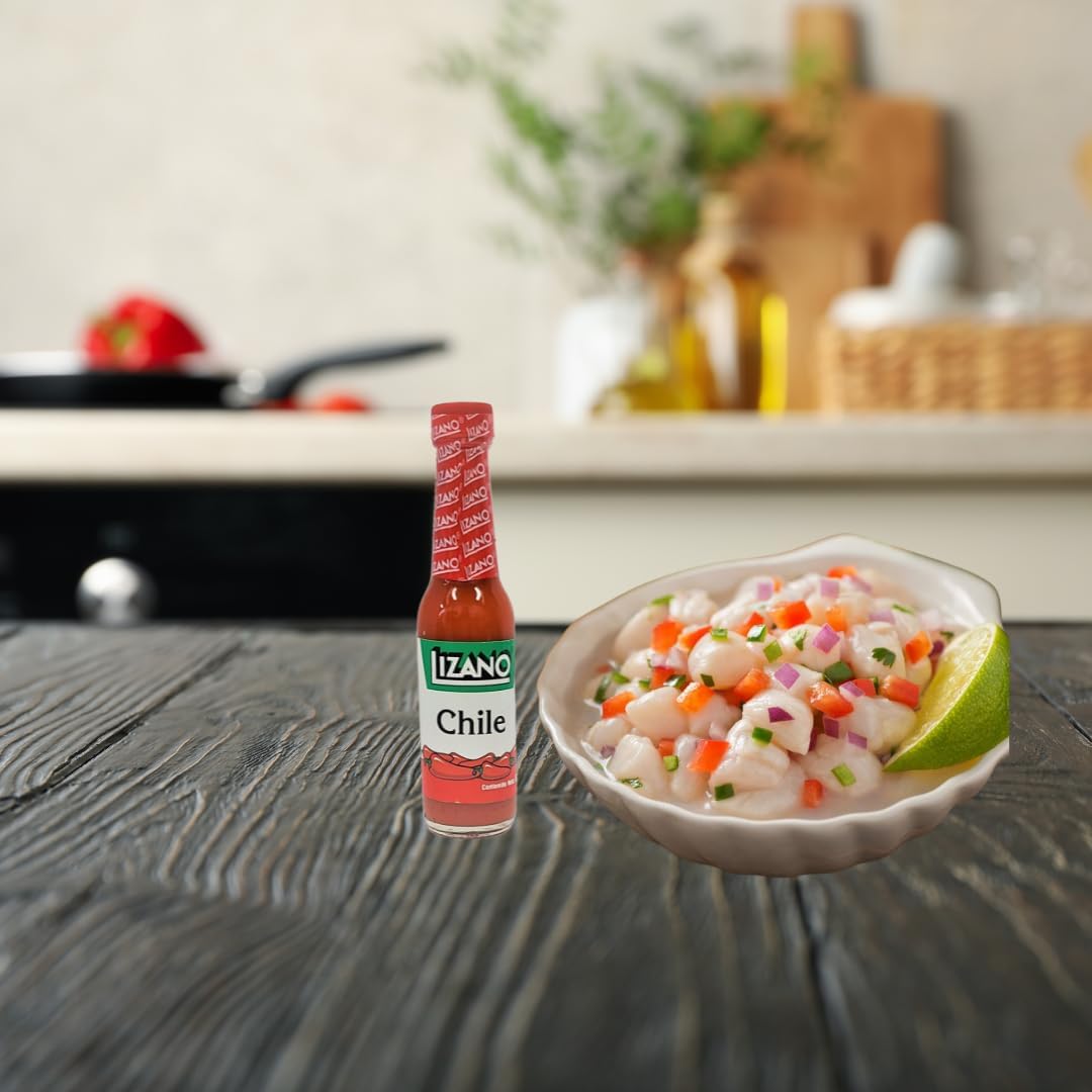 Lizano extra spicy sauce bottle pouring over dish—great for seasoning and finishing heat