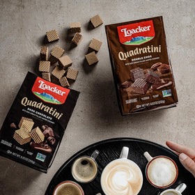 Loacker Quadratini chocolate wafers enjoy a creamy center in a convenient bite-sized treat