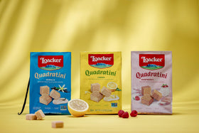 Loacker Quadratini vanilla wafer close-up, smooth creaminess ideal with tea or coffee.
