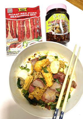 Lobo Thai Roast Red Pork Seasoning Mix in a wok during cooking