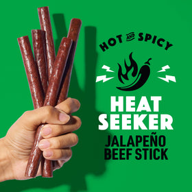 Lorissa's Kitchen Heat Seeker jalapeno beef sticks close-up with real jalapeño bits.