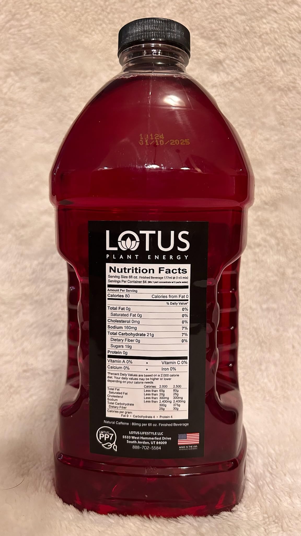 Pink Lotus Plant Power energy concentrate being poured for café-style drinks at home.