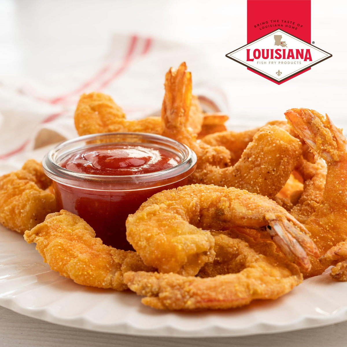 Louisiana Fish Fry Cocktail Sauce dip with seafood plate; elevates shrimp and crab flavors.