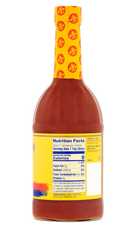 Louisiana Original Hot Sauce ingredients close-up with peppers, vinegar, salt.