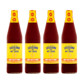 Louisiana Sweet Heat Honey Hot Sauce pack of four bottles ready for meals.