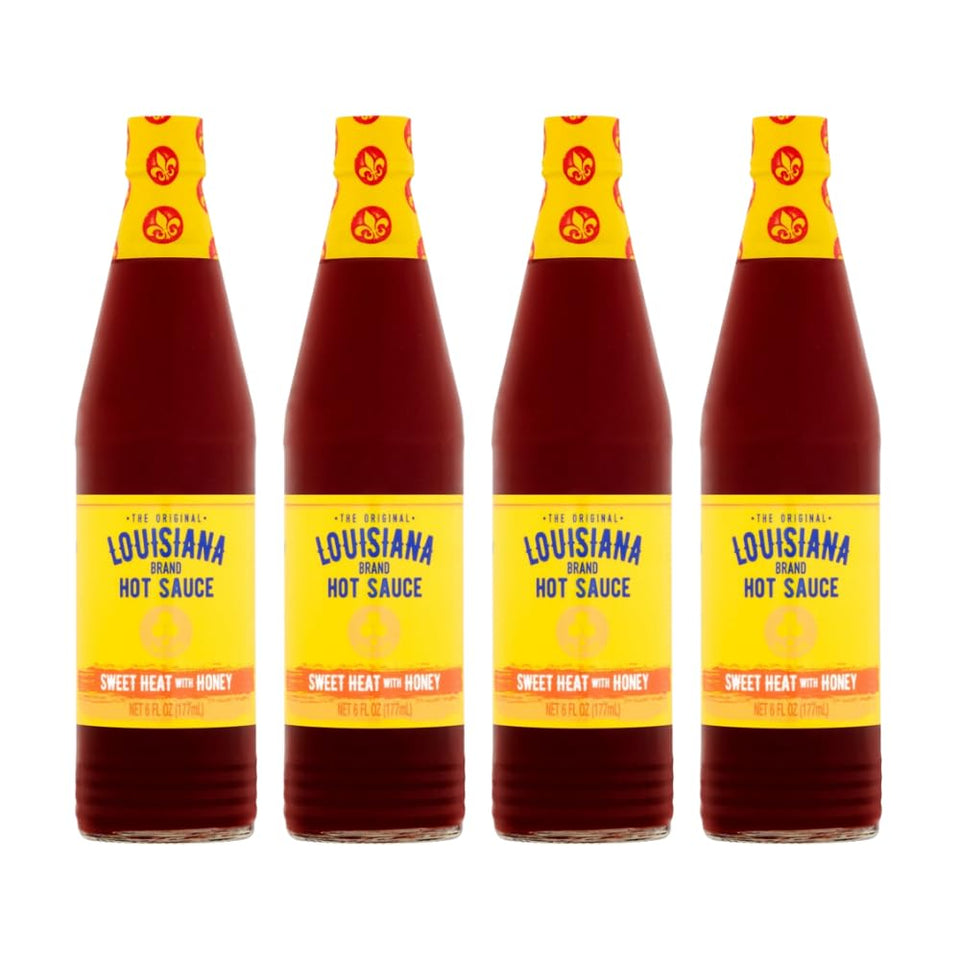 Louisiana Sweet Heat Honey Hot Sauce pack of four bottles ready for meals.
