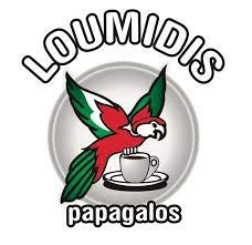 Steaming cup of Loumidis Papagalos traditional coffee in a briki