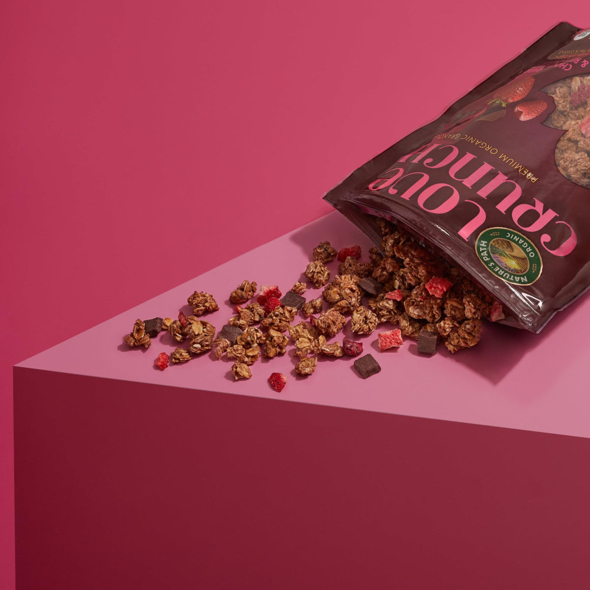Love Crunch granola ingredients show oats, berries and chocolate for a satisfying breakfast.