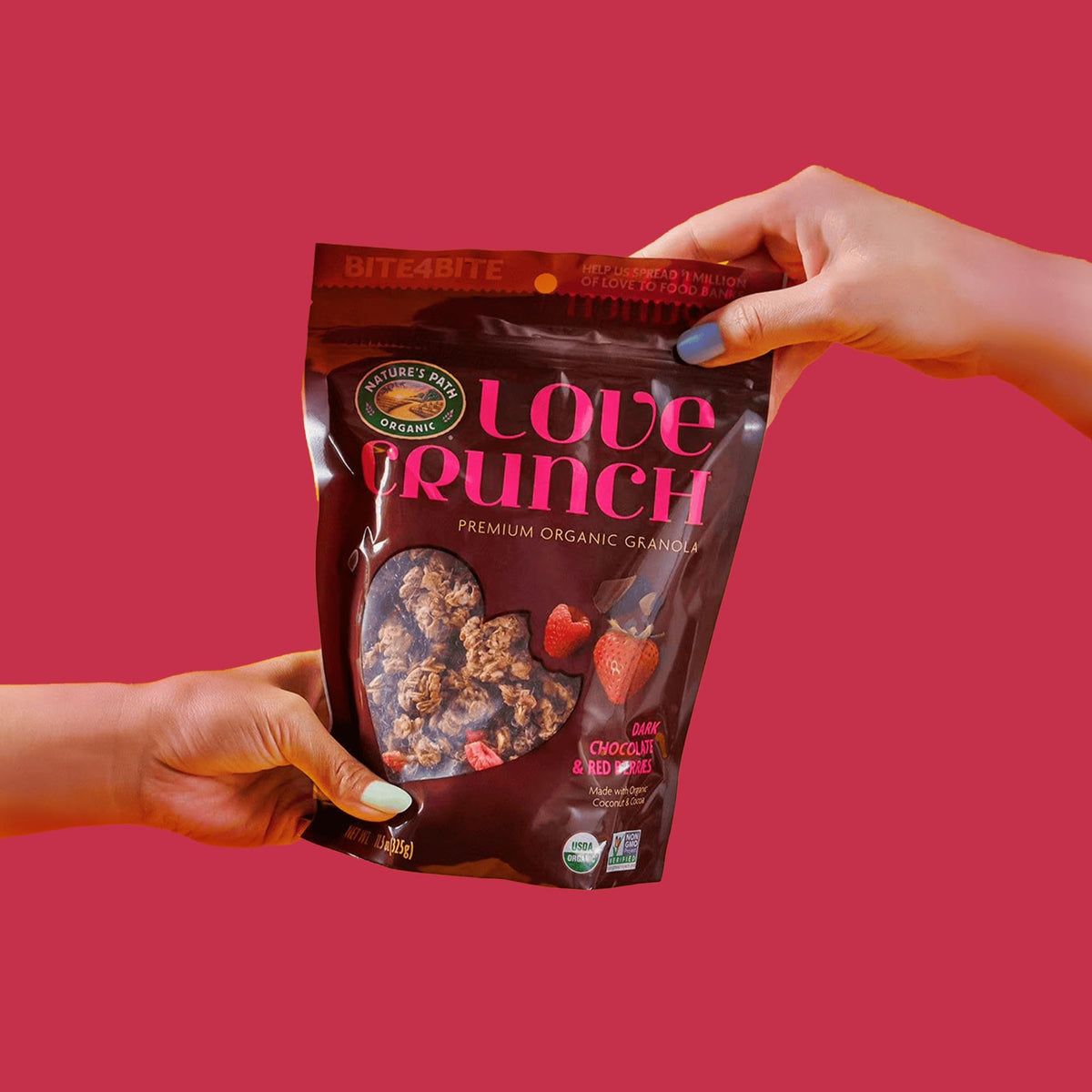Love Crunch granola being poured into a yogurt bowl for topping.
