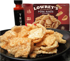 Lowrey's Bacon Curls variety packets show Original and Spicy options.