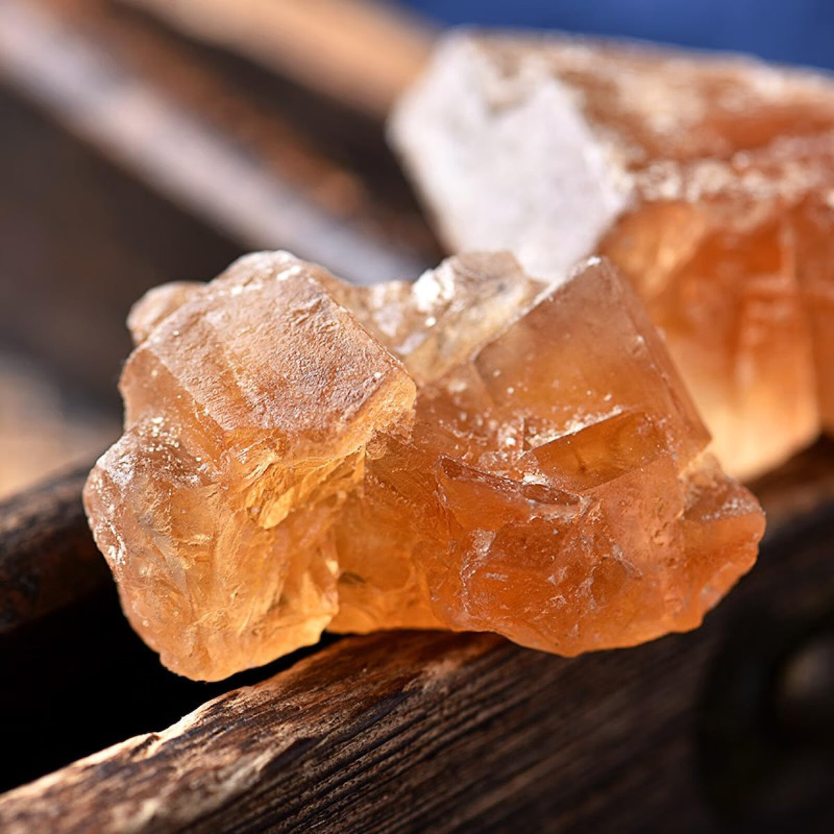 Lucentis yellow rock sugar crystals displayed in a storage jar.