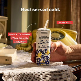 Serving Lucille chocolate shake with fruit enhances a balanced snack.