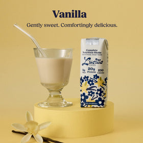 Lucille Complete Nutrition Vanilla Shake poured into glass, smooth texture highlights ready-to-drink convenience.