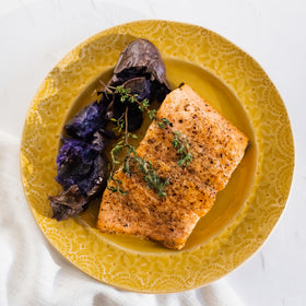 Lucini olive oil on salad plate, ideal for dressings and marinades