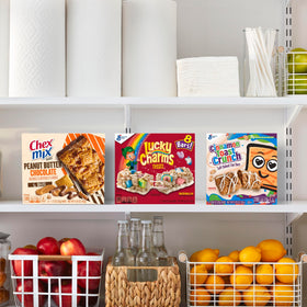Lucky Charms Treat Bars six-box carton on kitchen counter.