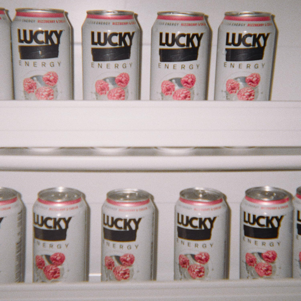 Lucky Energy Rizzberry-Cream can on the counter, ideal pre-workout fuel.