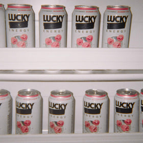 Lucky Energy Rizzberry-Cream can on the counter, ideal pre-workout fuel.