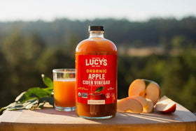 Lucy’s 34oz glass bottle shows premium packaging preserving flavor.