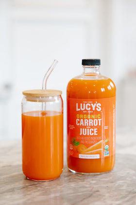 Lucy’s Carrot Juice label detail showing organic and non-GMO quality