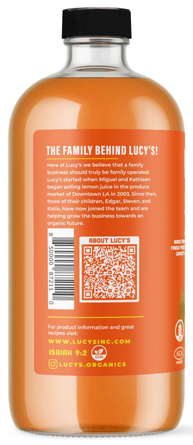 Lucy’s Carrot Juice being poured into a glass to highlight smooth texture