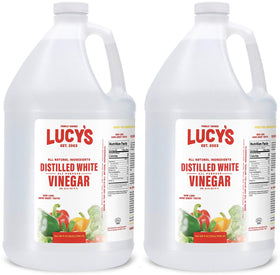 Lucy’s Natural Distilled White Vinegar bottle, a versatile kitchen staple for food prep and cleaning.