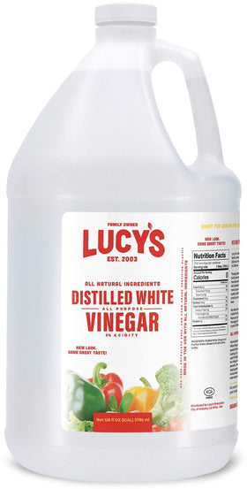 Lucy’s White Vinegar bottle pour illustrates versatile kitchen use and natural cleaning power.