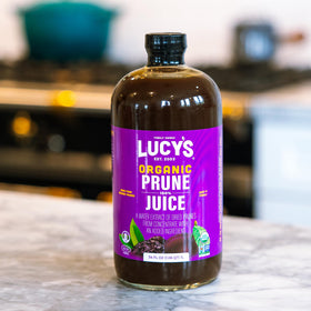 Lucy’s small-batch production scene emphasizes careful selection of organic prunes for flavor.