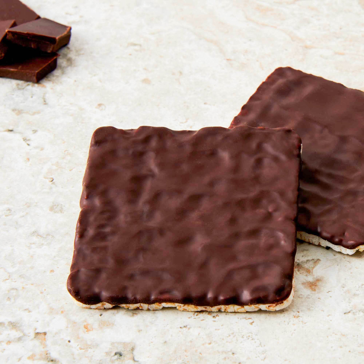 Lundberg Decadent Dark Chocolate Stackers on a snack board with berries