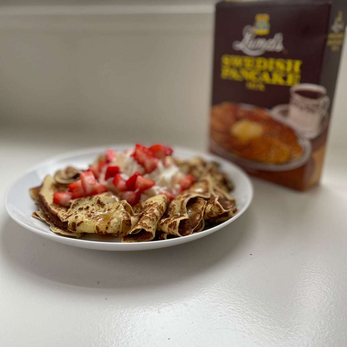 Kitchen counter with mix box, signaling quick, easy weekend brunch prep.