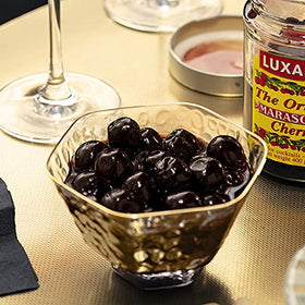 Luxardo cherries in syrup jar showcase authentic candied sour marasca flavor.