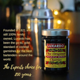 Luxardo cherries in a Manhattan glass illustrate depth and color boosts.