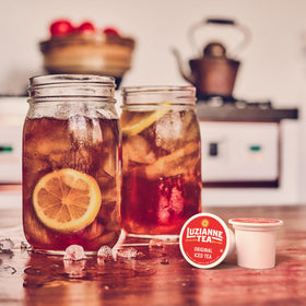 Luzianne iced tea being poured into a glass for refreshment.
