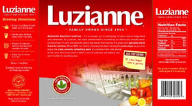 Luzianne iced tea brewed in a clear glass showing its bright color