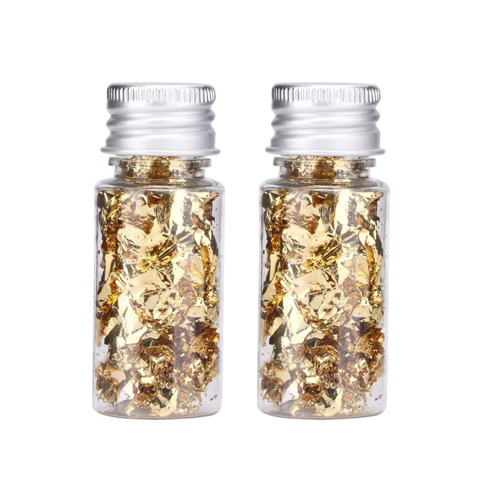 Lwuey gold leaf flakes on cake create a shimmering edible finish.