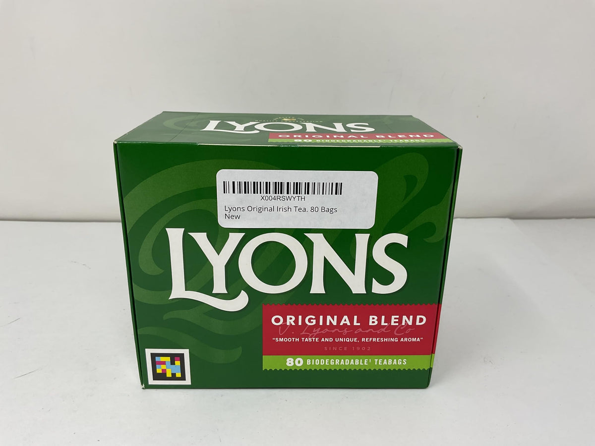 Pouring Lyons Original Irish Tea into a cup to savor the inviting aroma.