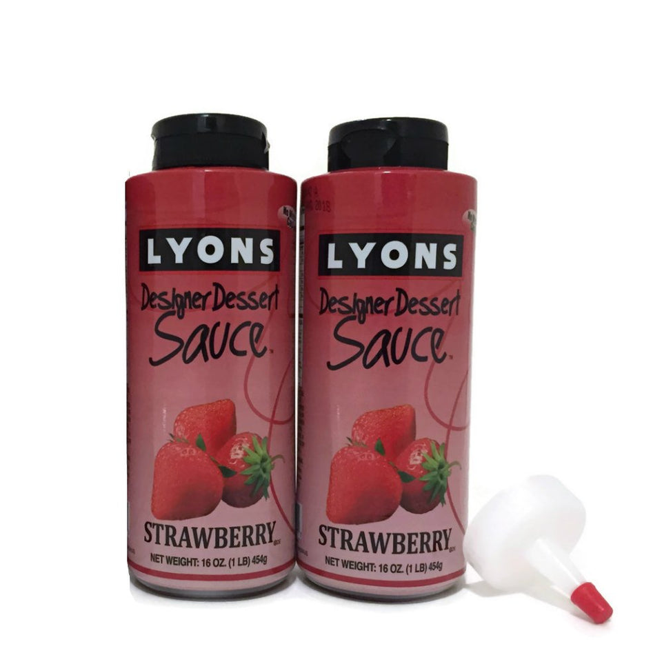 Lyons Strawberry Dessert Syrup bottle with applicator tip for precise topping.