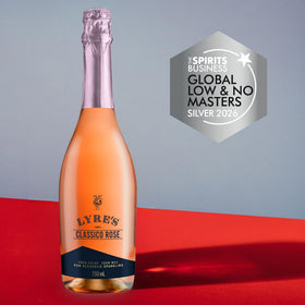 Lyre's Classico Rosé Sparkling glass pour closeup, fruity notes of cherries and strawberries.