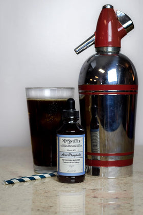MacSweetie's Acid Phosphate bottle on bar setup with drinks